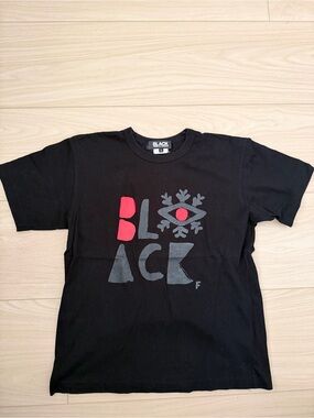 Comme des Garçons Black Graphic Tee with Red Accent